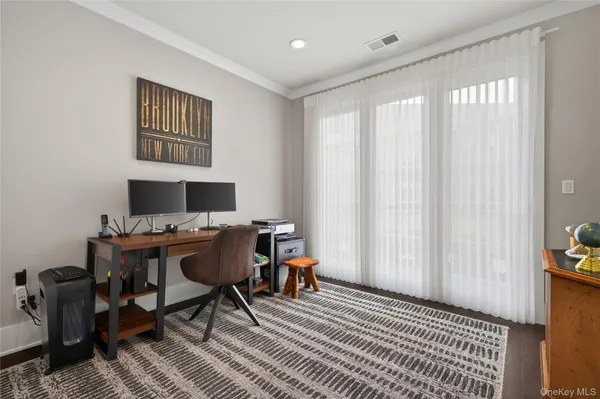 a workspace with furniture and a window