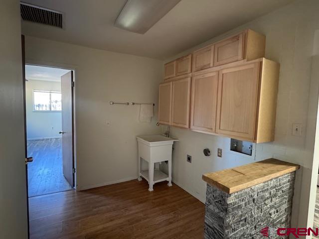 630 East Fourth Street, Unit A AND B Cortez, CO 81321 - Photo 16 of 28 a view of an empty room with wooden floor and a cabinet