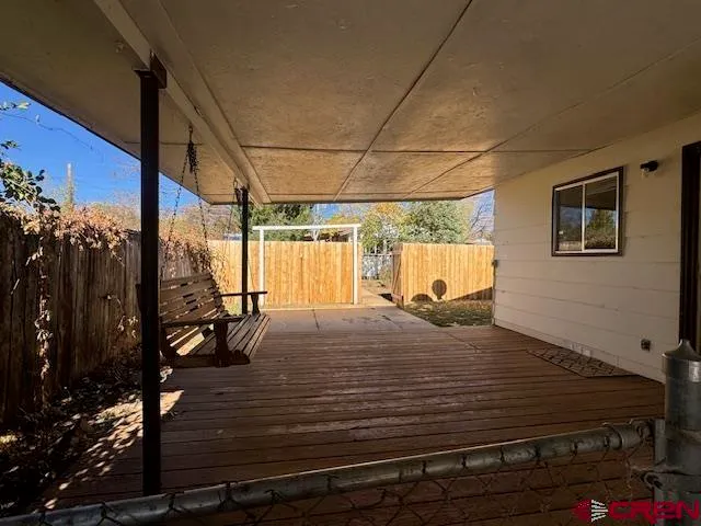 a bed sitting in a room next to a building