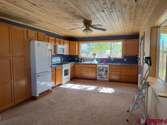 630 East Fourth Street, Unit A AND B Cortez, CO 81321 - Photo 23 of 28 a kitchen with stainless steel appliances granite countertop a stove a refrigerator and a sink with wooden cabinets