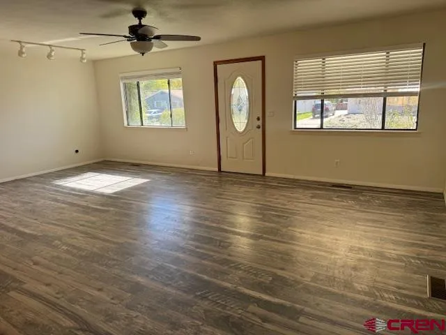 a view of an empty room with a window