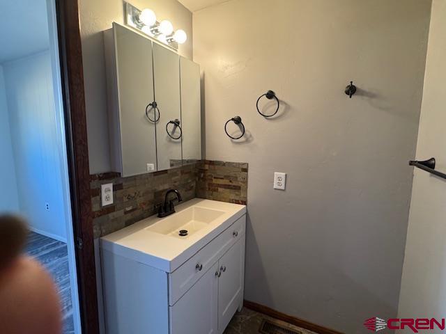 630 East Fourth Street, Unit A AND B Cortez, CO 81321 - Photo 8 of 28 a bathroom with a sink and a mirror