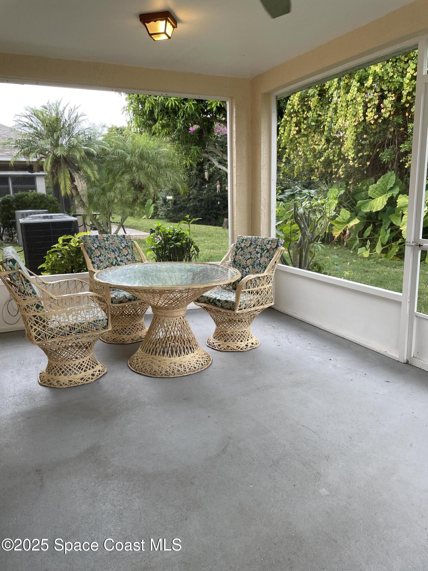 2065 Redwood Circle Palm Bay, FL 32905 - Photo 11 of 12 a living room with furniture and a large window