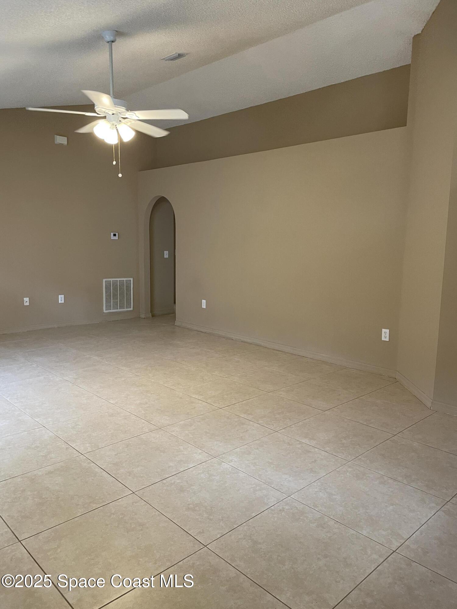 2065 Redwood Circle Palm Bay, FL 32905 - Photo 6 of 12 a view of a room with a fan