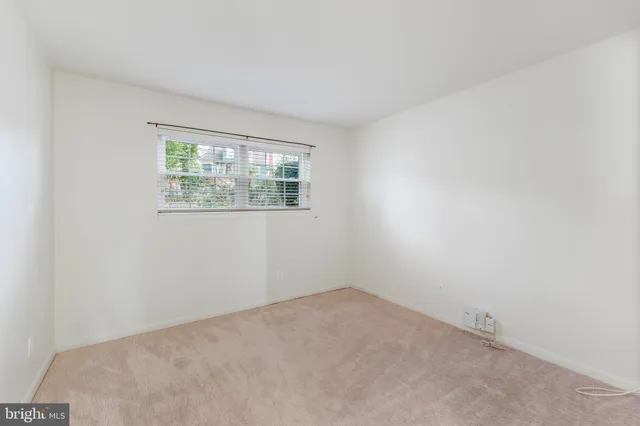 a bathroom with a toilet a sink a mirror a bathtub and vanity