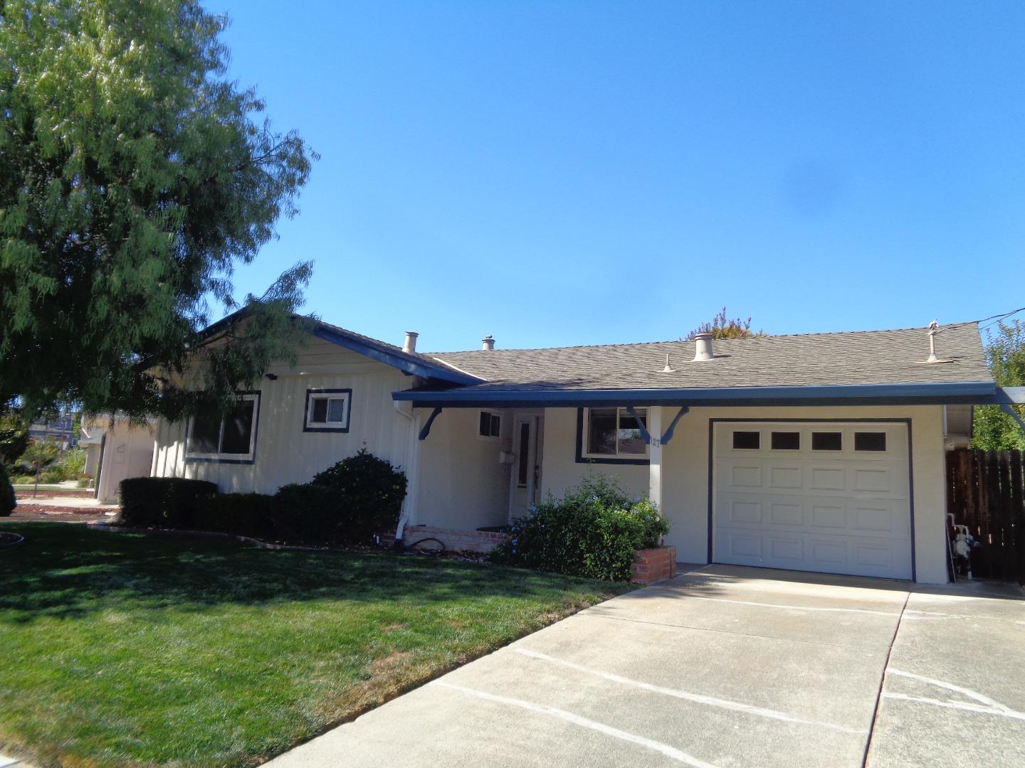 127 Dogwood Place San Ramon, CA 94583 - Photo 1 of 10 a front view of a house with a garden and yard