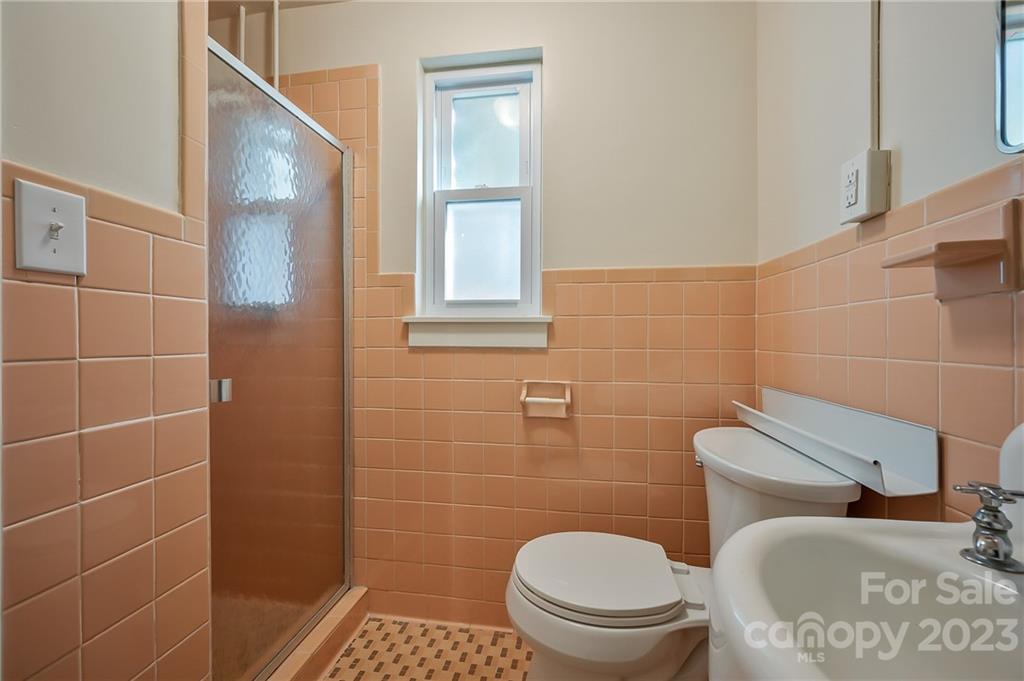 72 Doubleday Road Tryon, NC 28782 - Photo 35 of 46 a bathroom with a toilet and a sink