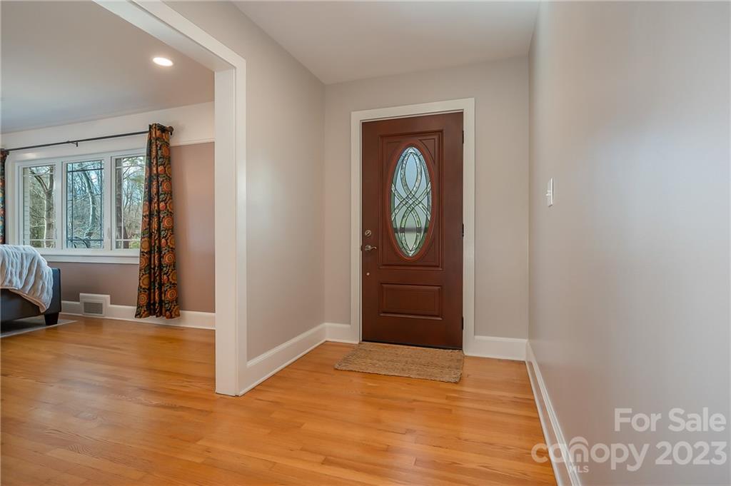 72 Doubleday Road Tryon, NC 28782 - Photo 8 of 46 a view of empty room with wooden floor