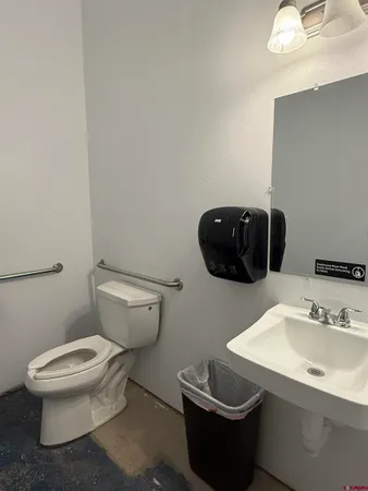 a bathroom with a toilet and a sink