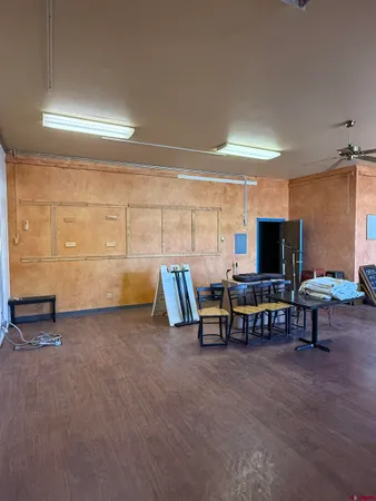 a view of a livingroom with furniture and a flat screen tv