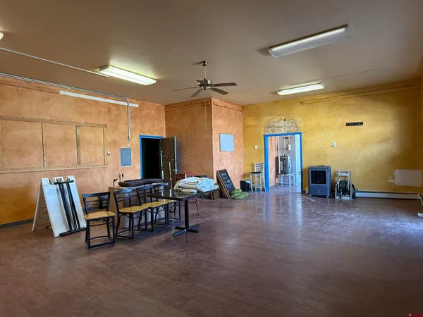 a view of a livingroom with furniture and a flat screen tv