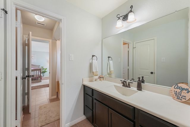 a bathroom with a sink double vanity and a mirror