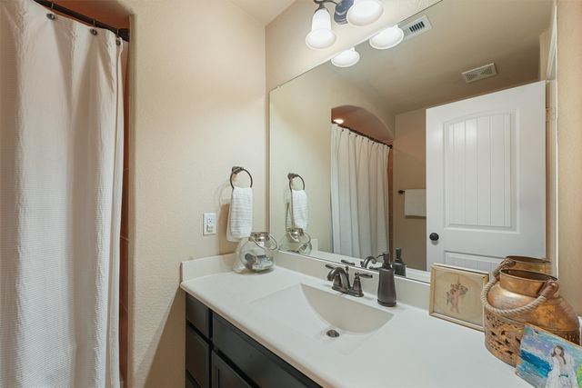 a bathroom with a sink double vanity and a mirror