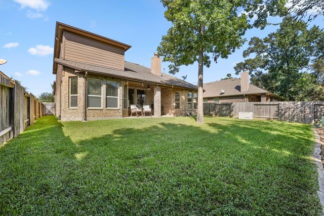 a view of a house with a yard porch and sitting area