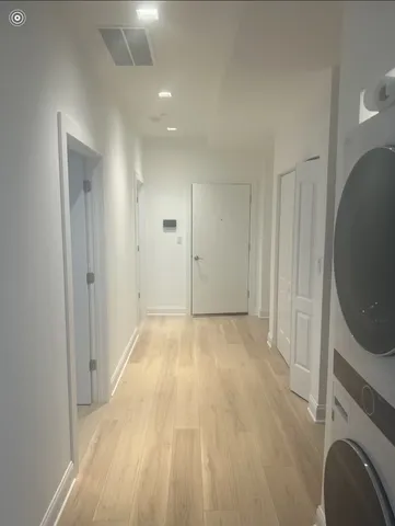 a view of empty room with washer and dryer