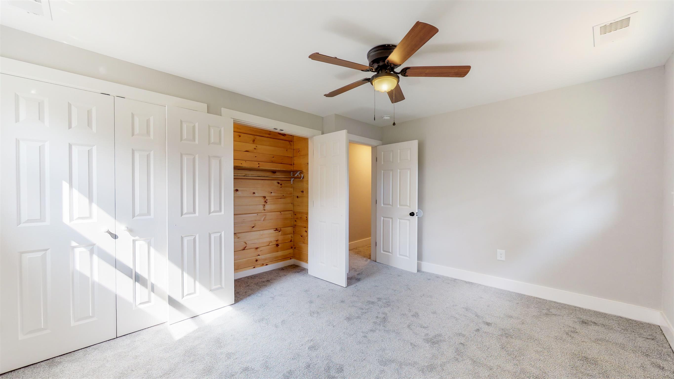 110 Green Acres Road Cottontown, TN 37048 - Photo 13 of 28 a view of a livingroom with a ceiling fan and window