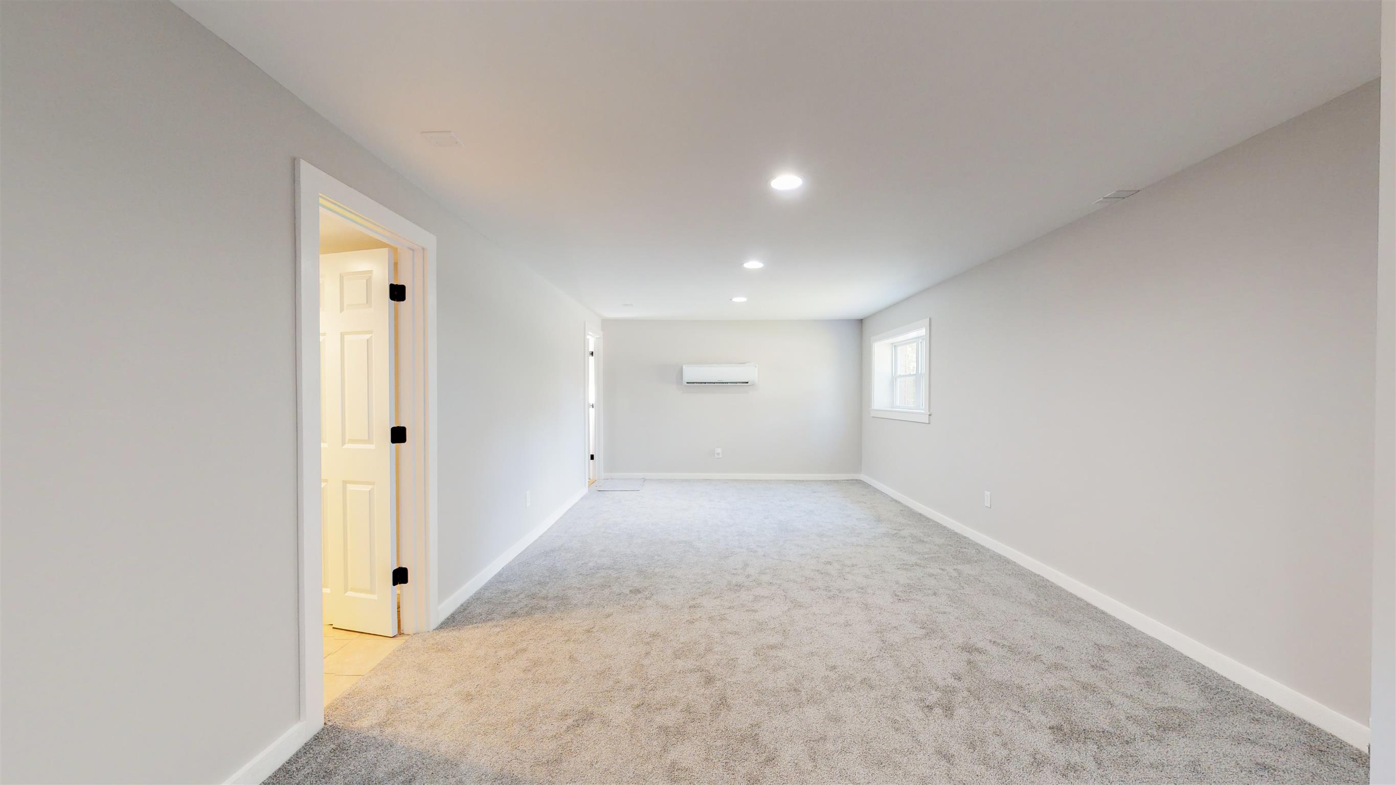 110 Green Acres Road Cottontown, TN 37048 - Photo 22 of 28 an empty room with windows and closet