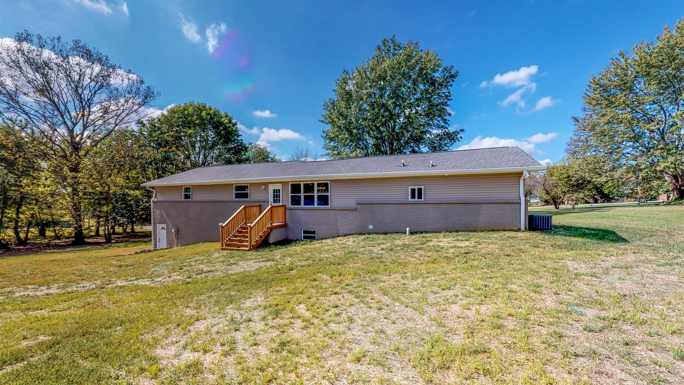 110 Green Acres Road Cottontown, TN 37048 - Photo 25 of 28 a view of a house with a yard