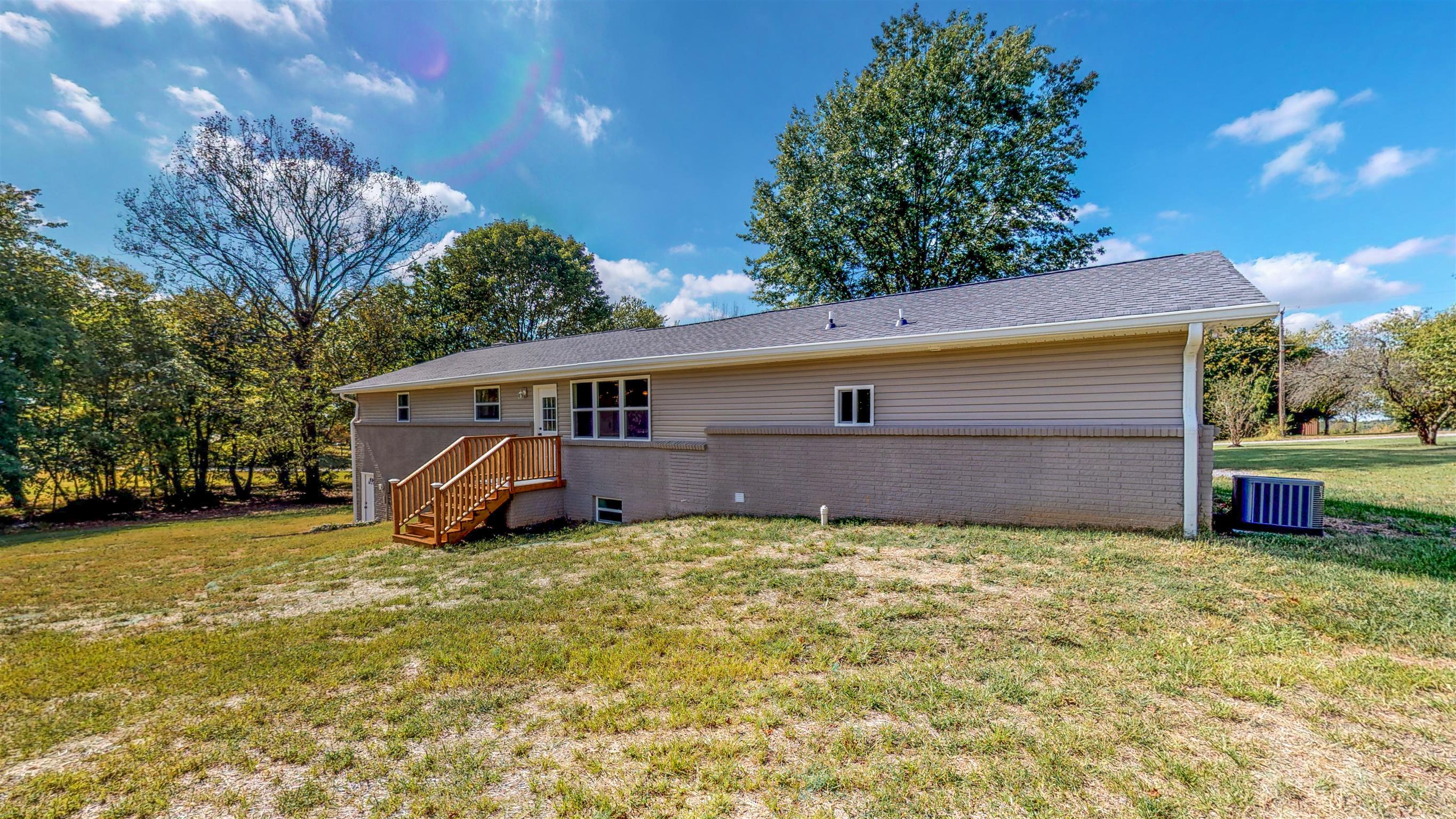 110 Green Acres Road Cottontown, TN 37048 - Photo 26 of 28 a view of a house with a yard