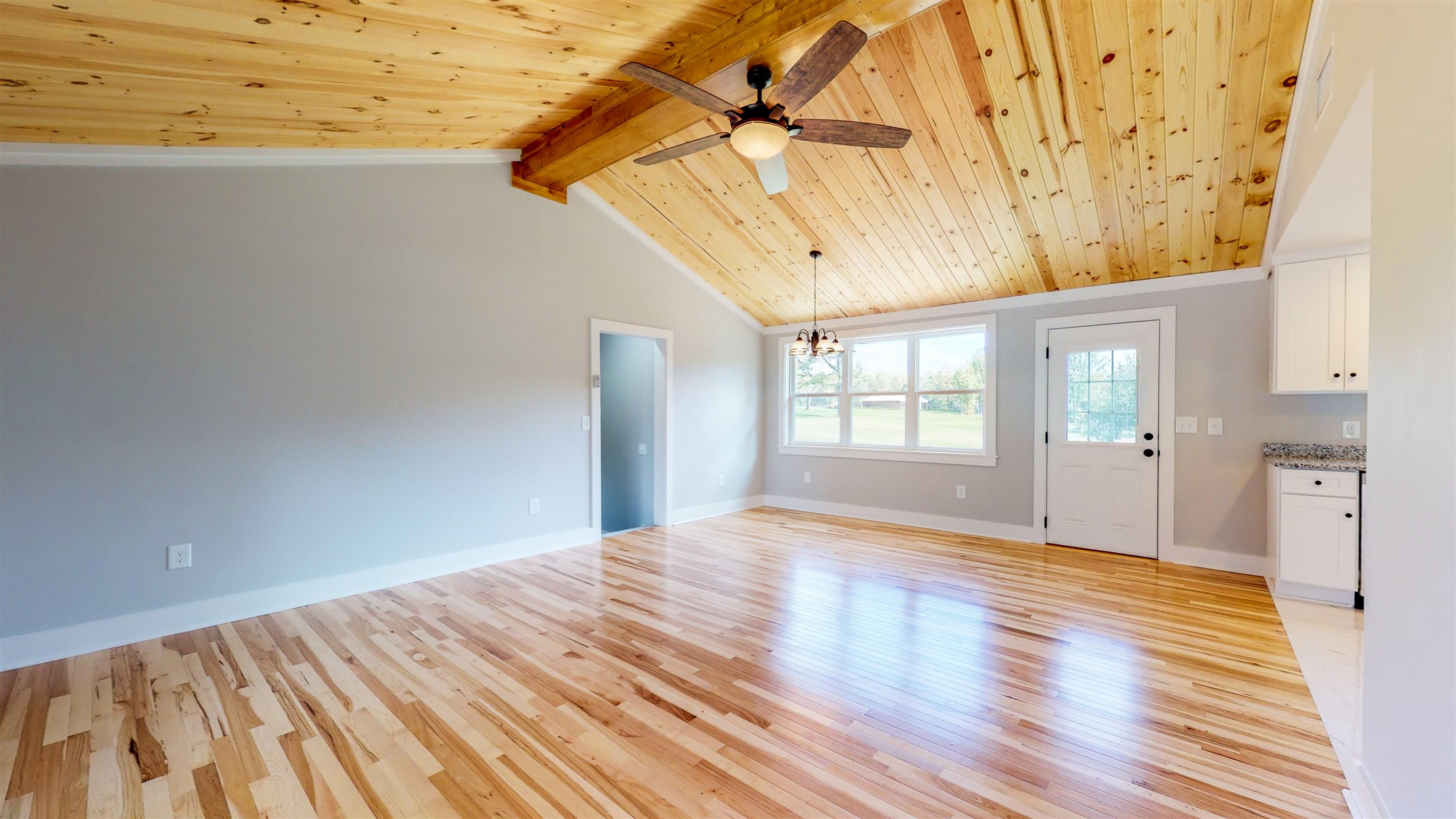 110 Green Acres Road Cottontown, TN 37048 - Photo 4 of 28 a view of empty room with wooden floor and fan