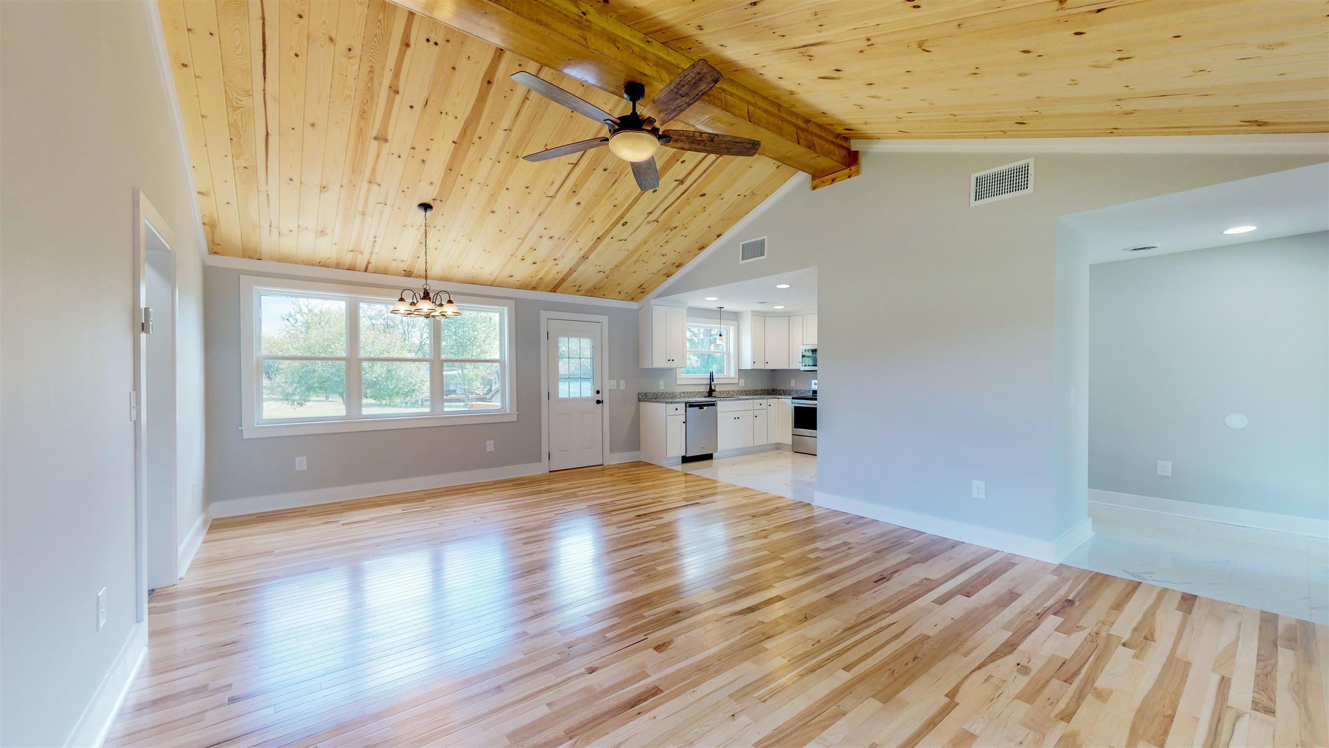 110 Green Acres Road Cottontown, TN 37048 - Photo 5 of 28 a view of empty room with wooden floor and fan