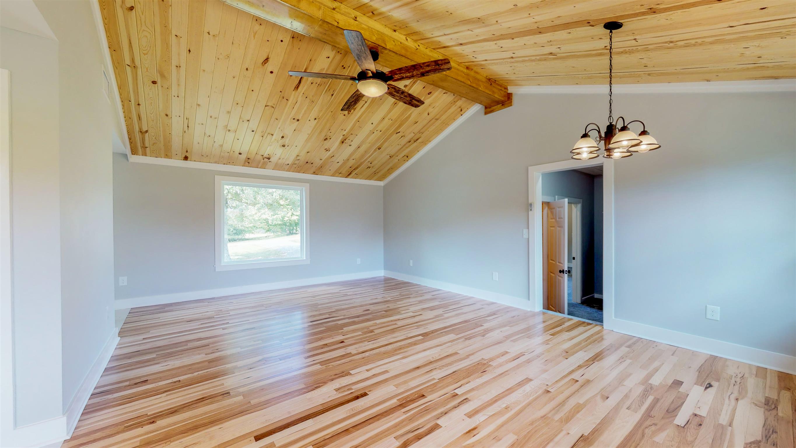 110 Green Acres Road Cottontown, TN 37048 - Photo 6 of 28 a view of a room with a ceiling fan and wooden floor