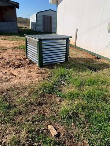 a view of a house with wooden walls