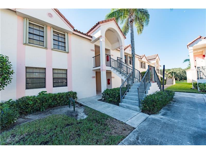3150 Leewood Terrace, Unit L224 Boca Raton, FL 33431 - Photo 1 of 14 a view of a house with a yard and plants
