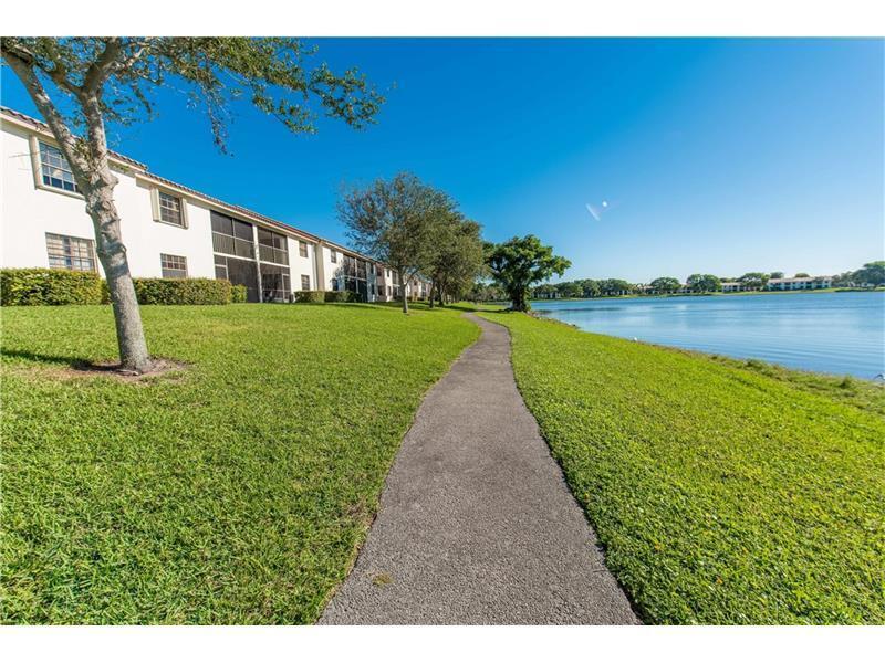 3150 Leewood Terrace, Unit L224 Boca Raton, FL 33431 - Photo 11 of 14 a view of a house with a yard
