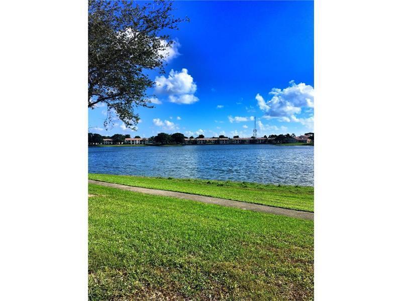 3150 Leewood Terrace, Unit L224 Boca Raton, FL 33431 - Photo 12 of 14 a view of a room with a big yard