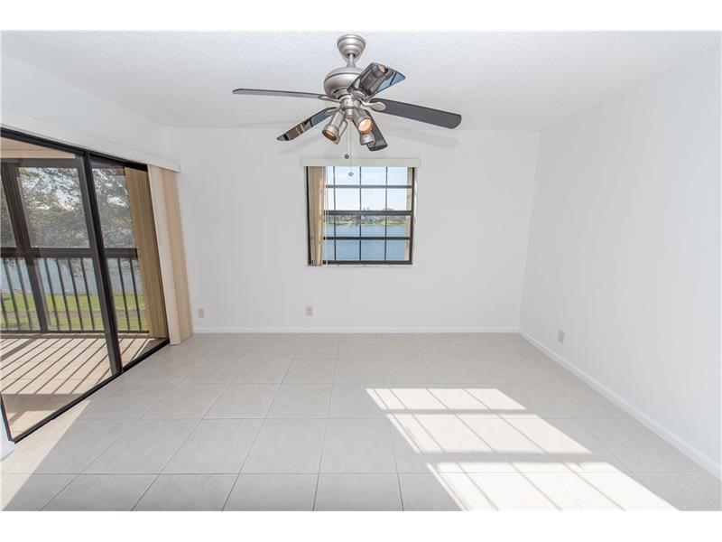 3150 Leewood Terrace, Unit L224 Boca Raton, FL 33431 - Photo 5 of 14 a view of wooden floor in a room