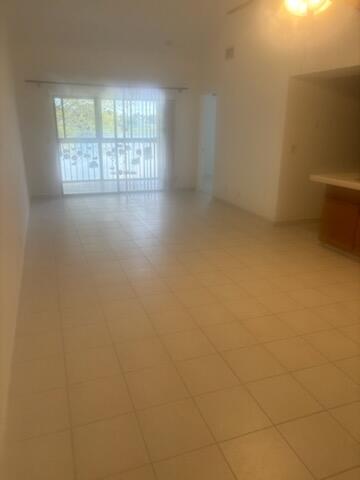 3150 Leewood Terrace, Unit L224 Boca Raton, FL 33431 - Photo 8 of 14 a view of an empty room with a window