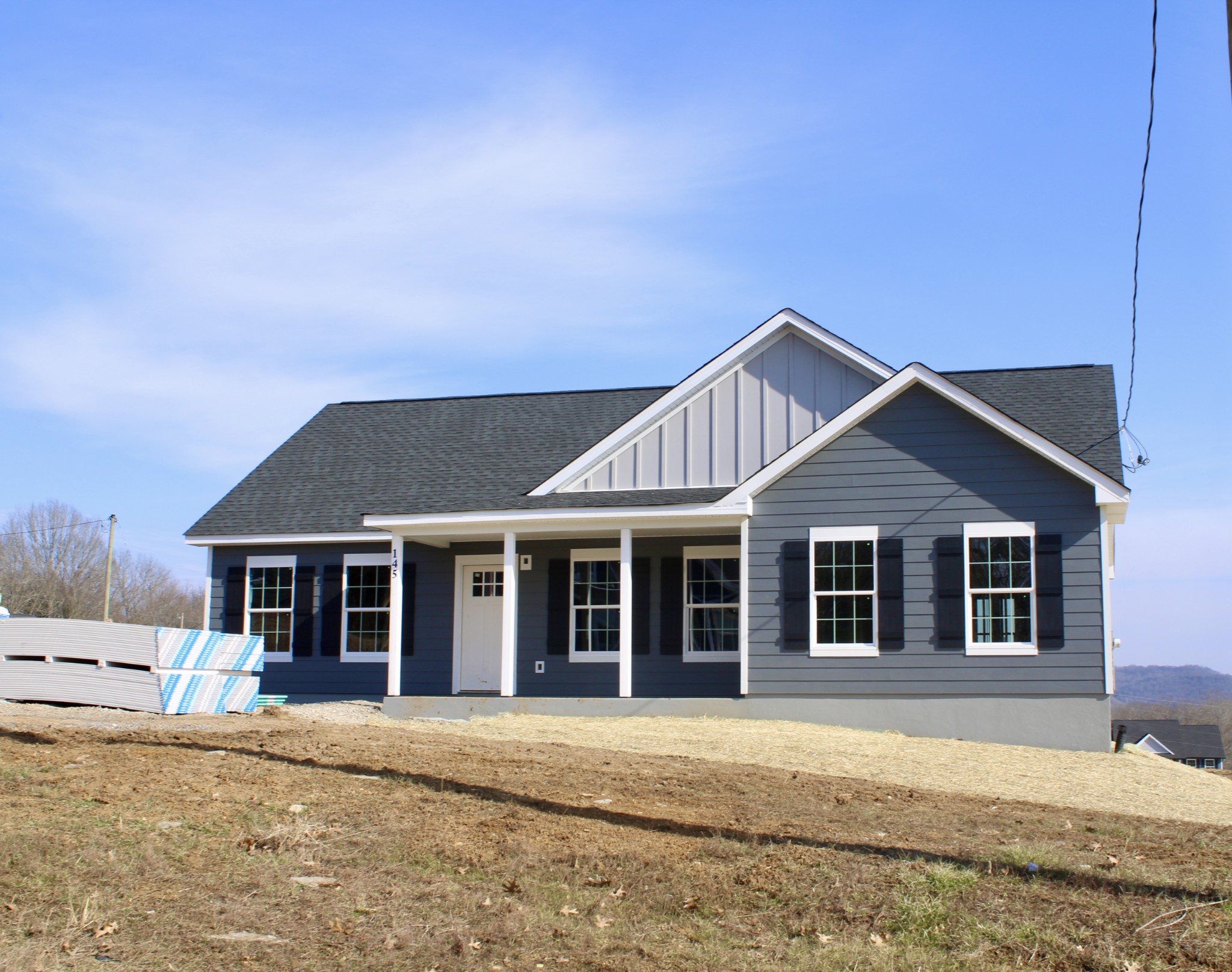 0 Alice Preston Loop Gordonsville, TN 38563 - Photo 1 of 25 a front view of a house with a garden