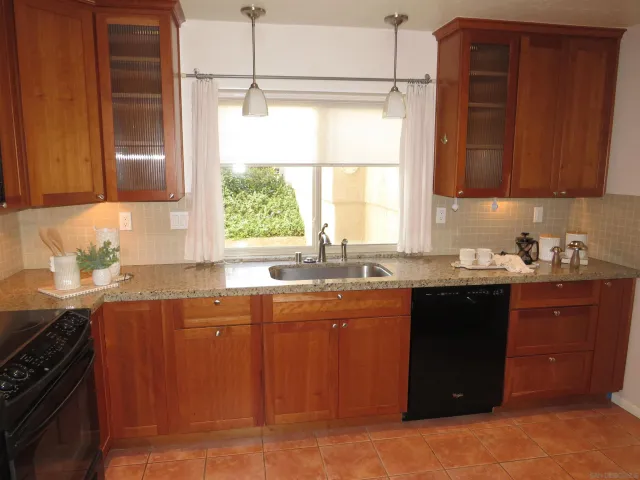 a bathroom with a shower and a sink