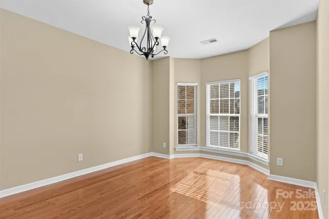 a view of empty room with windows