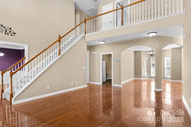a view of an entryway with wooden floor