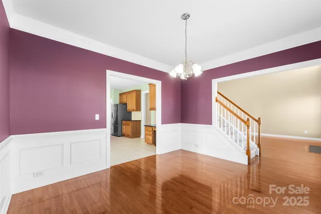 a view of a hallway with a chandelier