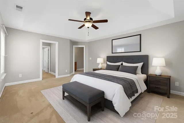 a spacious bedroom with a bed and window