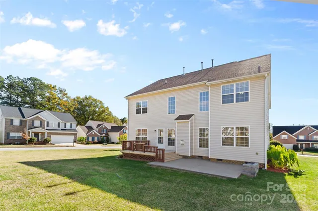 a view of house with swimming pool outdoor seating area