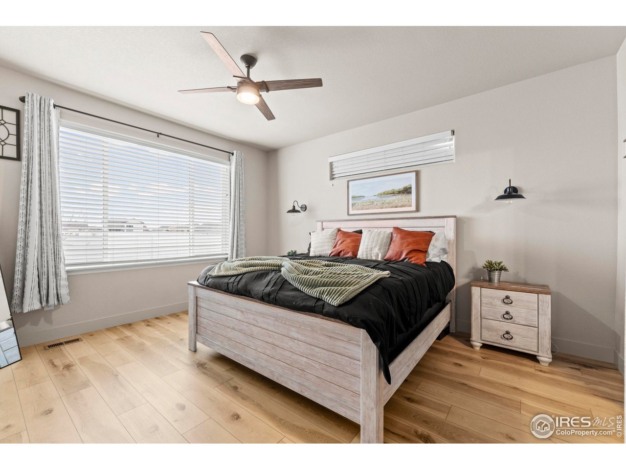 1216 Muskox Street Severance, CO 80550 - Photo 14 of 37 a bedroom with a bed and window