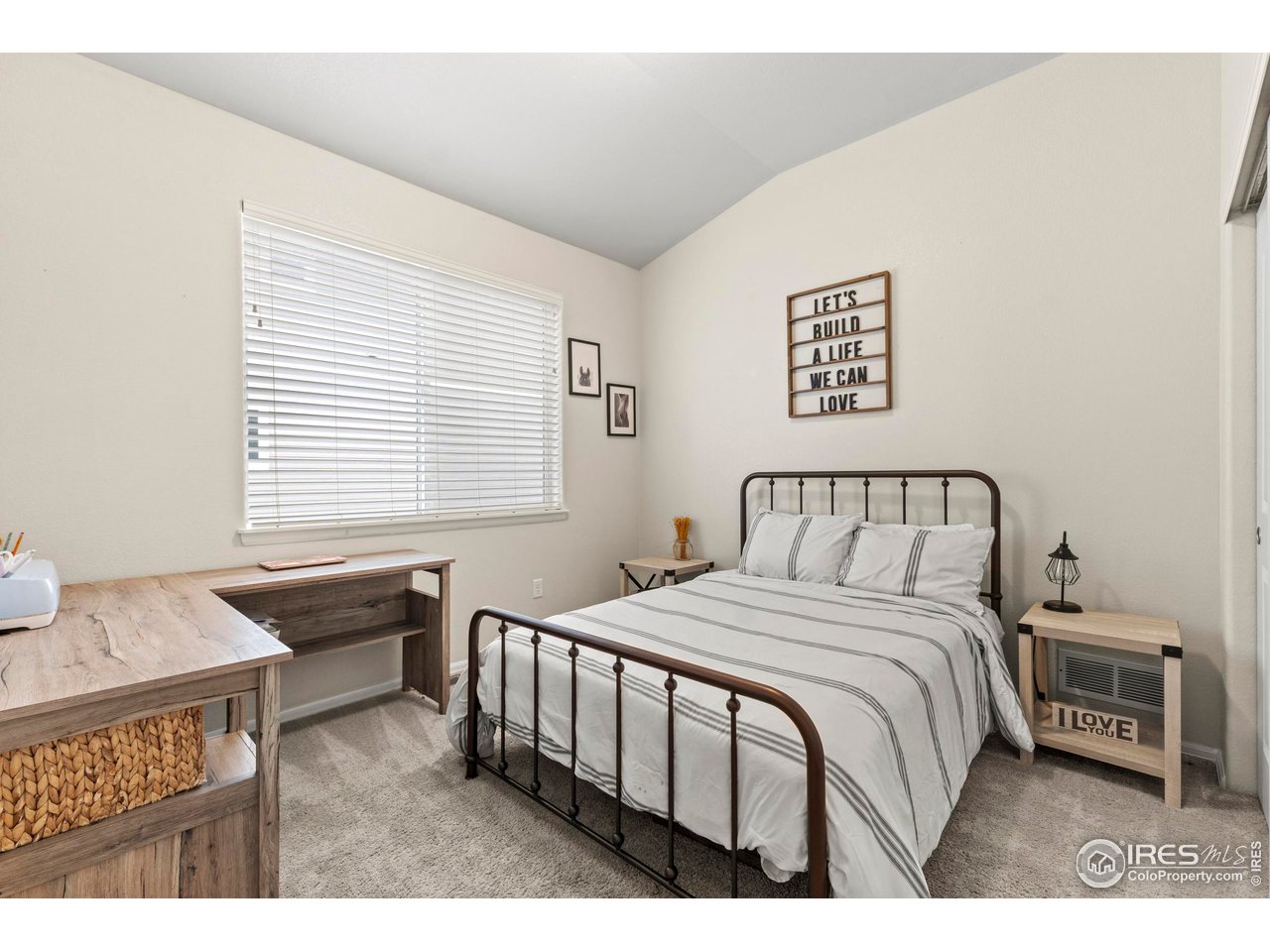 1216 Muskox Street Severance, CO 80550 - Photo 22 of 37 a bedroom with a bed a couch and a dresser