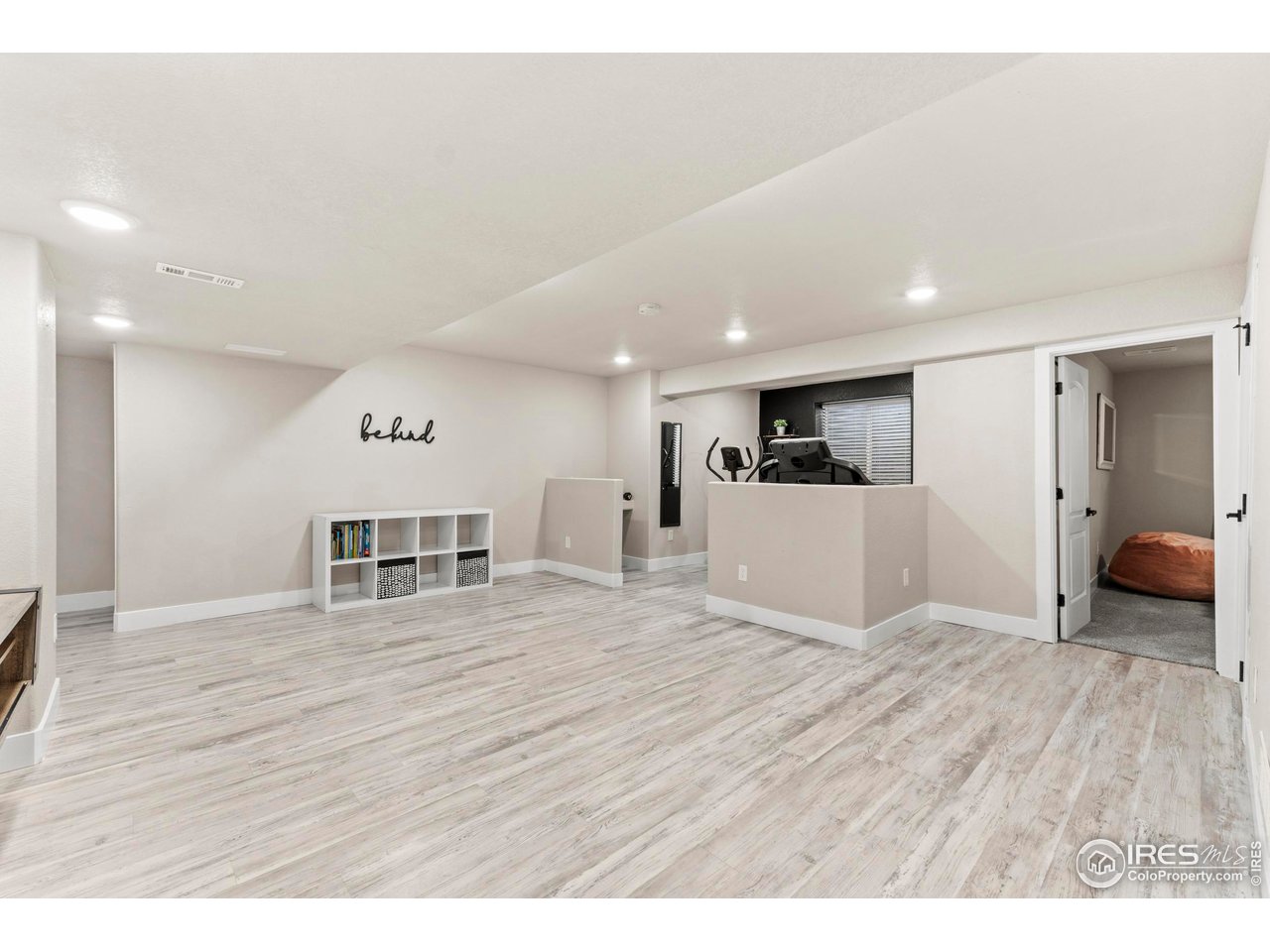 1216 Muskox Street Severance, CO 80550 - Photo 26 of 37 a view of a kitchen with wooden floor