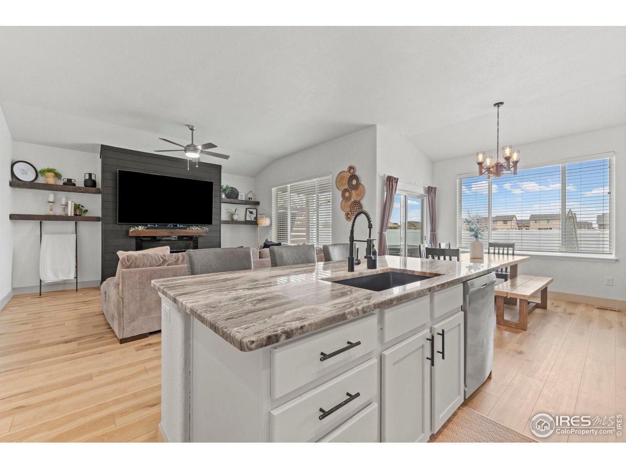 1216 Muskox Street Severance, CO 80550 - Photo 3 of 37 a view of living room with granite countertop furniture and flat screen tv