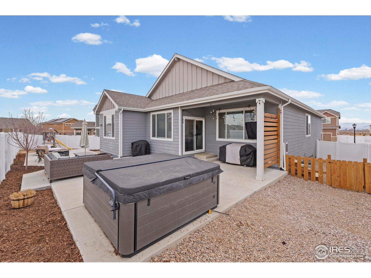 1216 Muskox Street Severance, CO 80550 - Photo 34 of 37 a view of a house with backyard and a tree