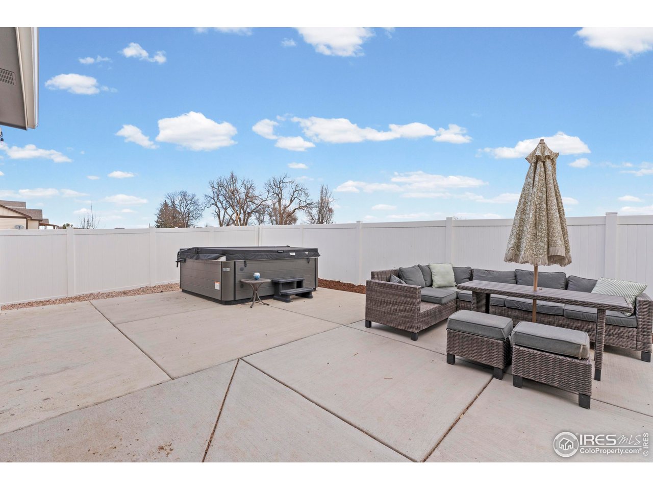 1216 Muskox Street Severance, CO 80550 - Photo 36 of 37 a living room with furniture and a large window