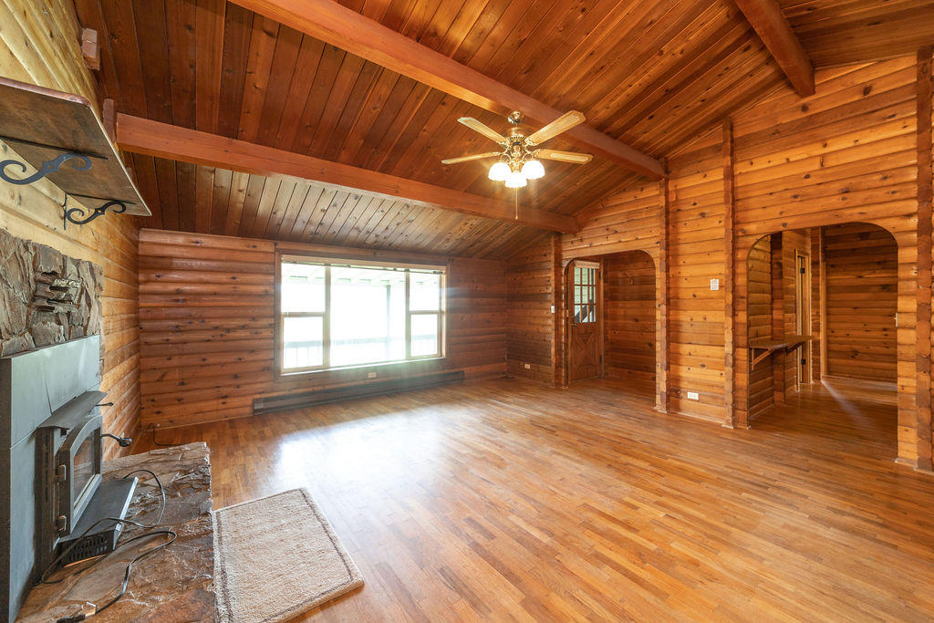 61395 Ward Road Bend, OR 97702 - Photo 2 of 56 a view of empty room with wooden floor and fan