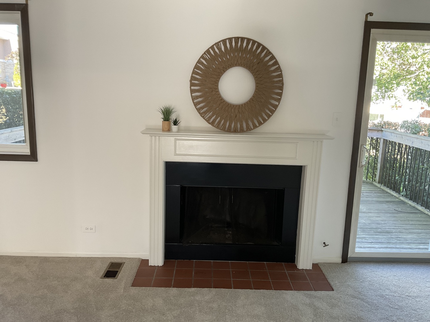 1129 Rhodes Court Wheaton, IL 60189 - Photo 2 of 2 a view of a livingroom with a fireplace and window