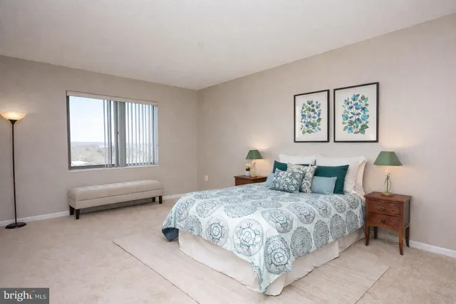 a bedroom with a bed and a couch