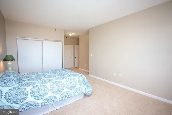 a large white bed in a white room