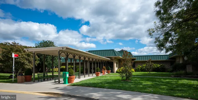 a view of a house with a yard and a garden